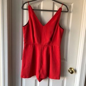 Red romper with black lace detail in back